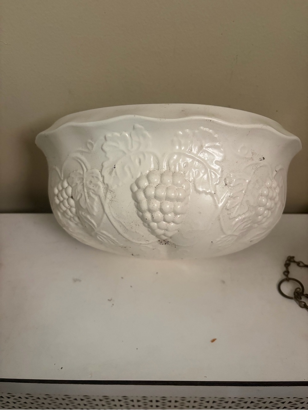 Vintage white ceramic wall planter with grapes